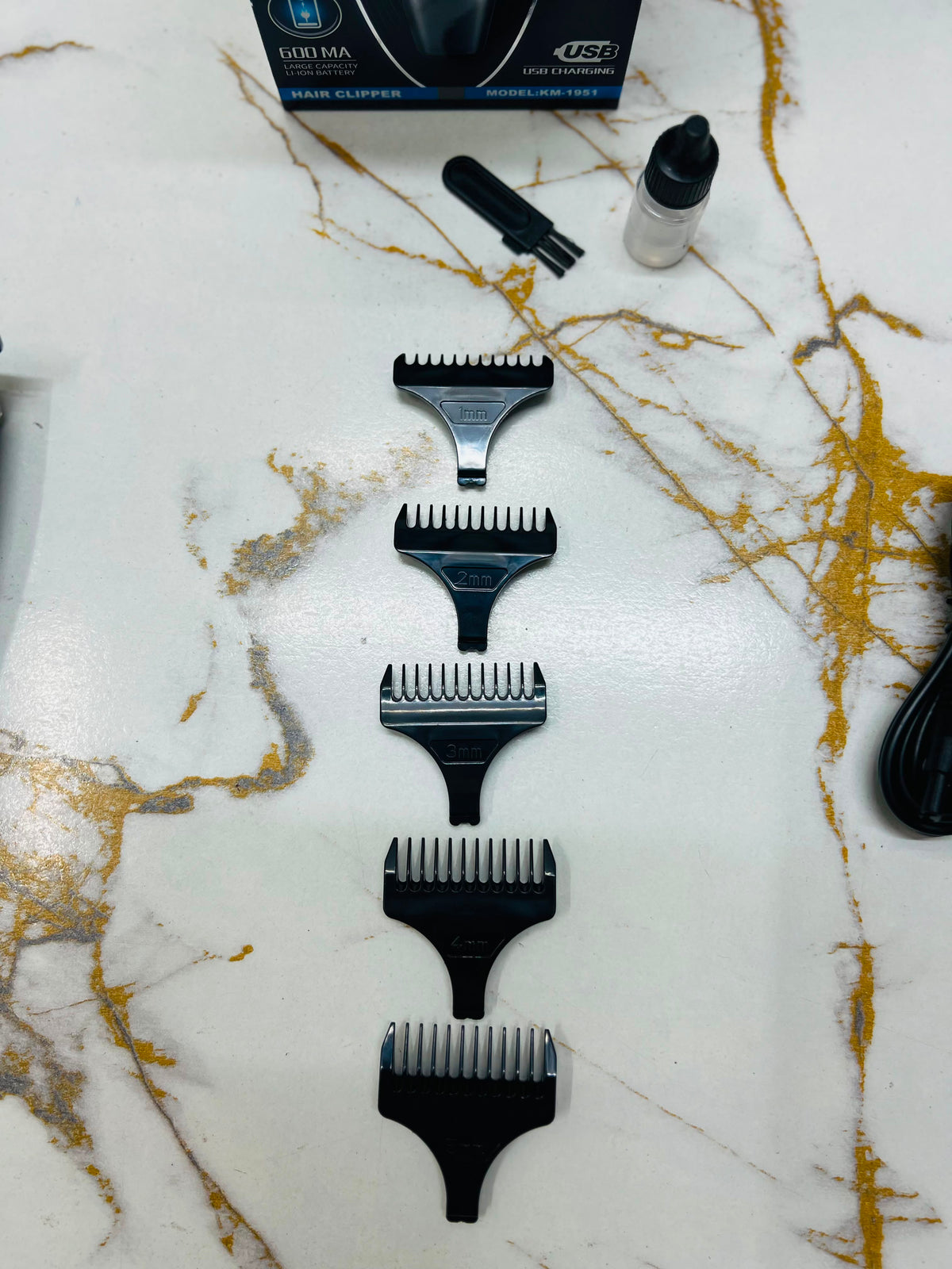 KEMEI LM-1951 Professional Hair Clipper – Carbon Steel Blades with 1, 2, 3, 4 & 5mm Guide Combs